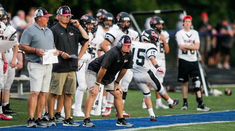 Franklin coach Brad Childers keeps his eyes on the action during a game at Edgewood’s Kumler Field on Aug. 31. NICK GRAHAM/STAFF