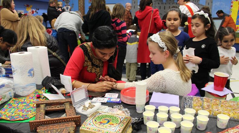 J.F. Burns Elementary School celebrated its diversity with a multicultural fair. At one station, students learned about the Indian body art form Mehndi. CONTRIBUTED