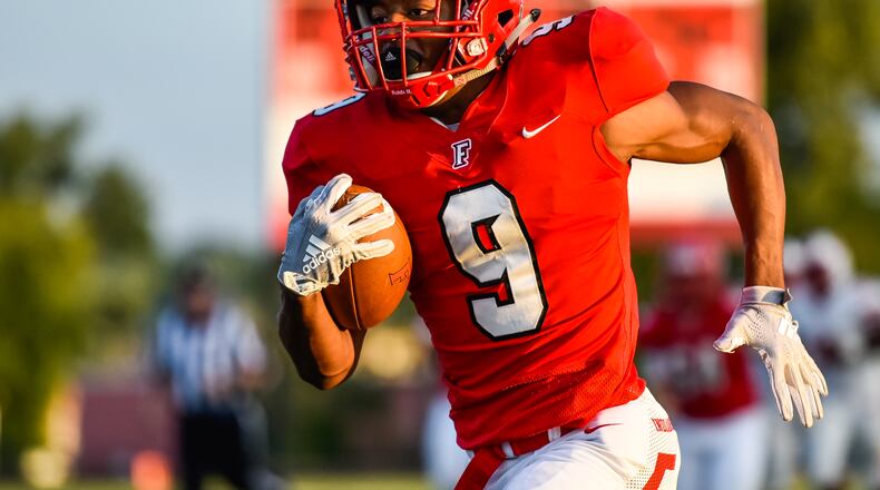 Fairfield’s Jutahn McClain carries the ball for a touchdown during a Sept. 14 game against Lakota West at Fairfield Stadium. The host Indians won 37-3. NICK GRAHAM/STAFF