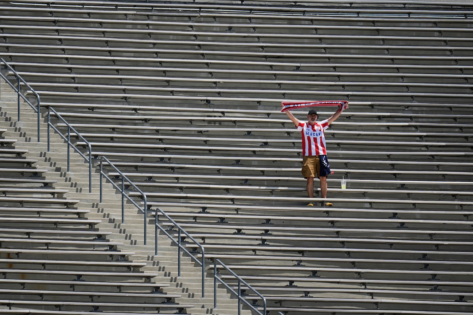 A fan from Atletico Madrid cheers prior to the Club World Cup Group B soccer match between Atletico Madrid and Botafogo in Pasadena, Calif., Monday, June 23, 2025. (AP Photo/Greg Bull)