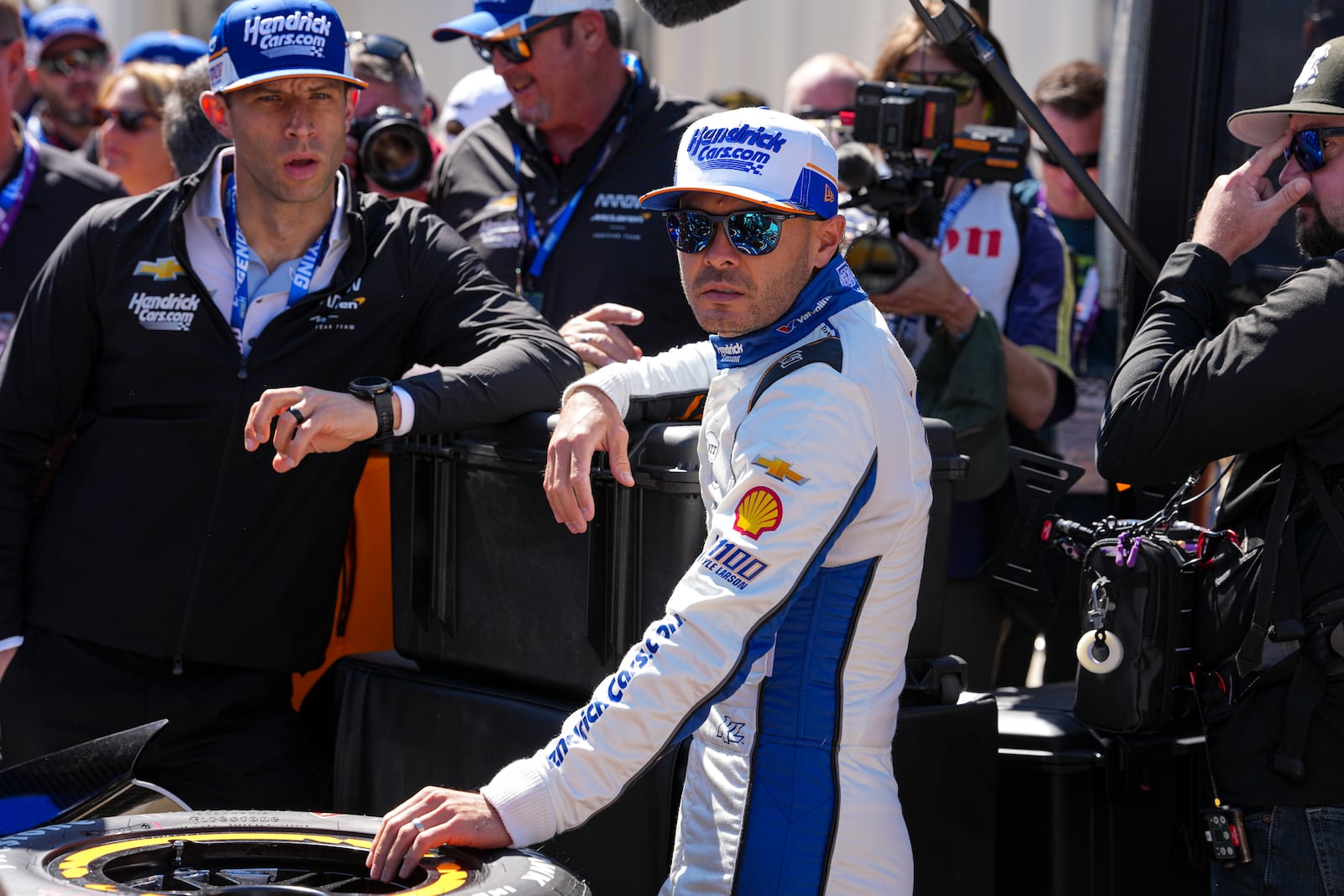 Kyle Larson waits for the start practice for the Indianapolis 500 auto race at Indianapolis Motor Speedway in Indianapolis, Friday, May 23, 2025. (AP Photo/Michael Conroy)