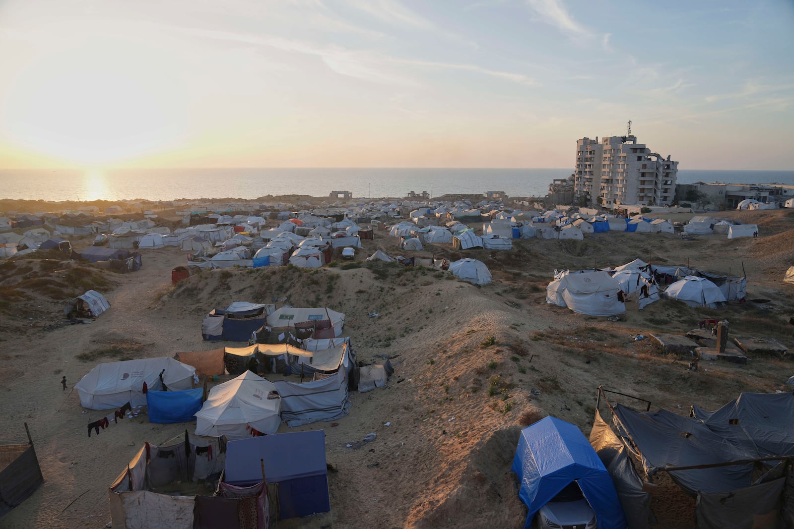 A view of a makeshift tent camp for Palestinians displaced by the Israeli air and ground offensive on the Gaza Strip, in Gaza City, Saturday, April 19, 2025. (AP Photo/Jehad Alshrafi)