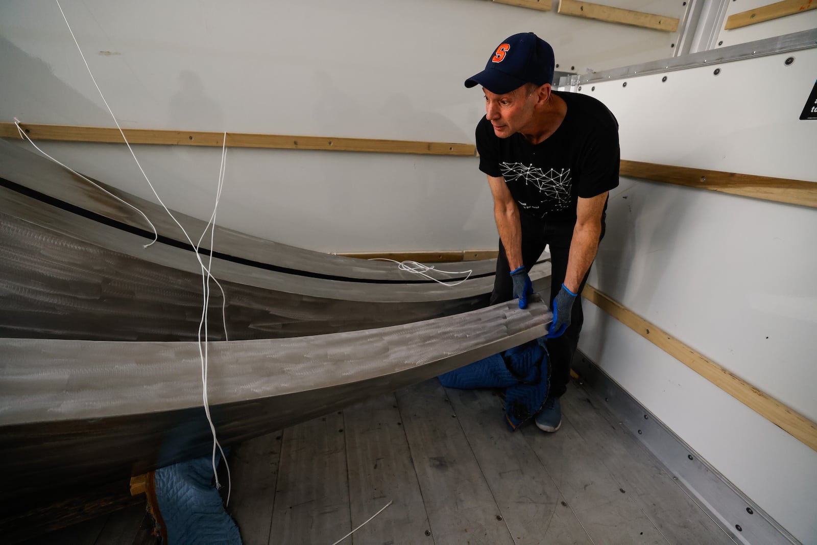 Pyramid Hill Sculpture Park employees work to unload a sculpture by internationally recognized sculptor and public artist Barton Rubenstein Friday, March 6, 2026. The new piece will be on display in April. NICK GRAHAM/STAFF