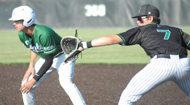 Badin first baseman Reese Anzalone holds on a Chaminade Julienne runner during Friday's Division II regional final at Mason. Chris Vogt/CONTRIBUTED