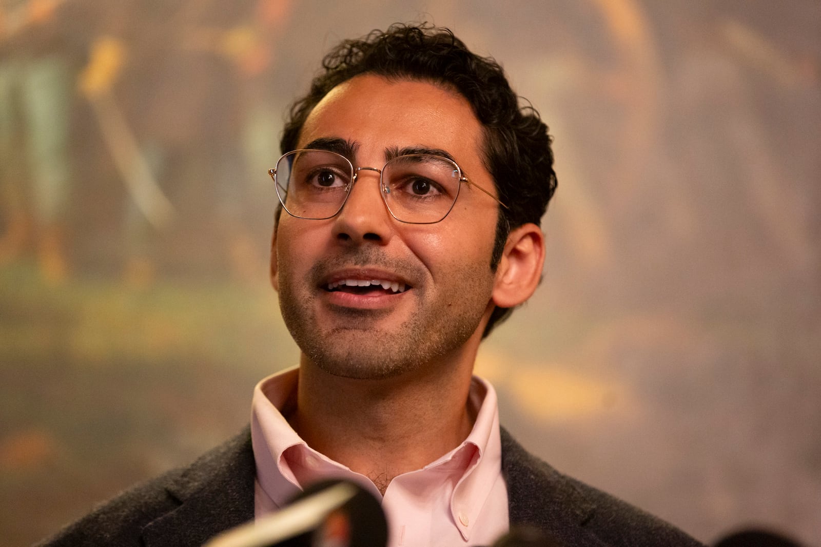 Mohsen Mahdawi speaks during a press conference announcing the launch of the Vermont Immigration Legal Defense Fund in the Cedar Creek Reception Room at the Vermont State House on Thursday, May 8, 2025, in Montpelier, Vt. (AP Photo/Alex Driehaus)
