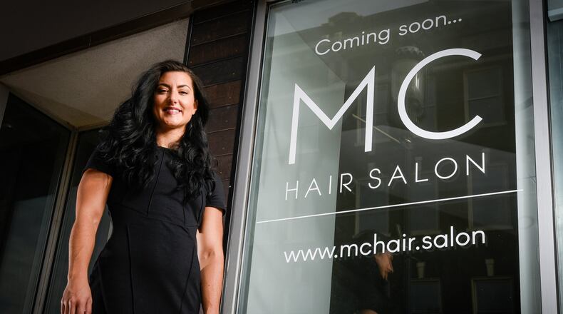 Mary Catherine Venturella stands outside MC Hair Salon, which remained under construction Thursday, Oct. 6, at 1131 Central Ave. in Middletown. She plans to open in mid-November when the salon construction is complete. NICK GRAHAM/STAFF