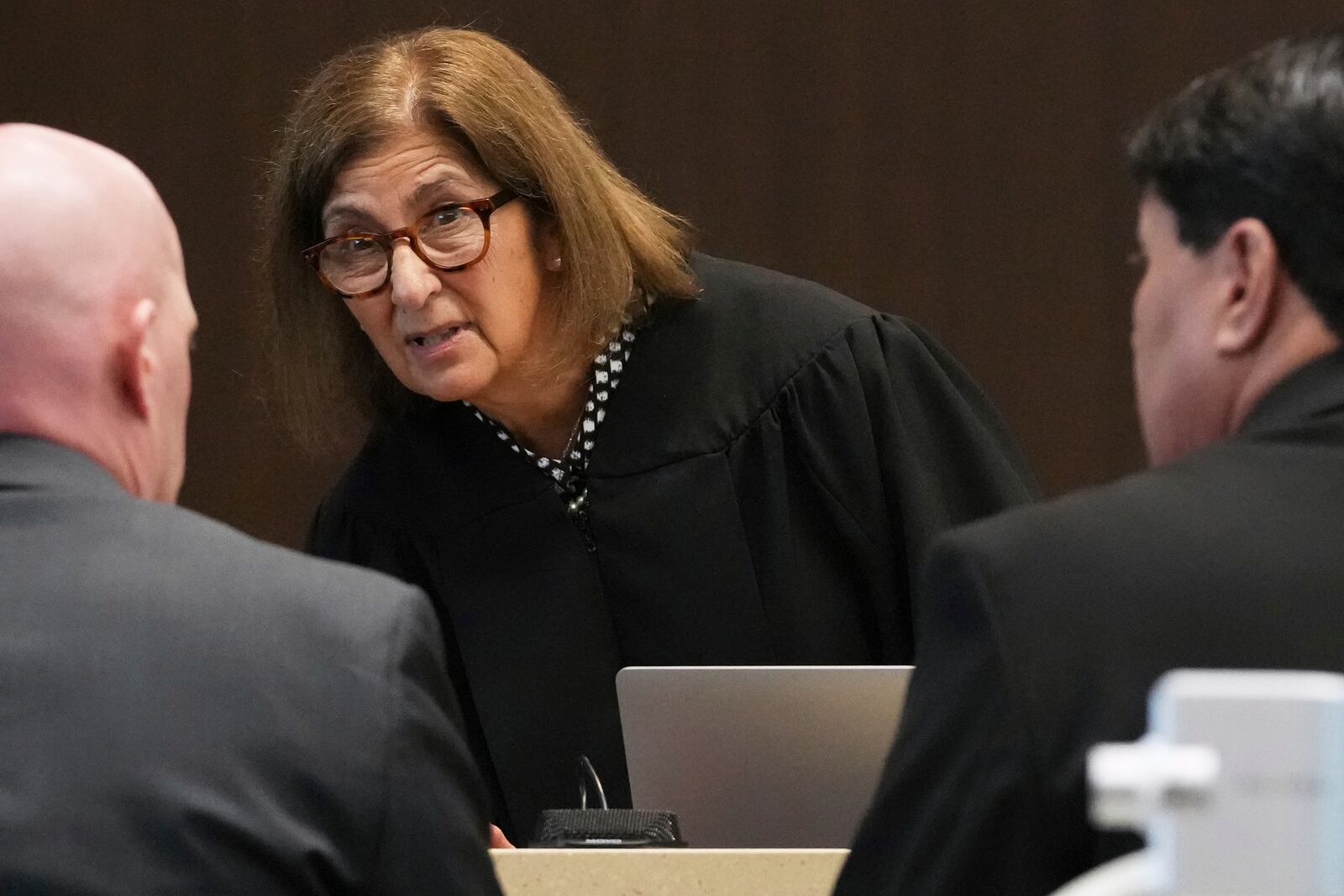 Judge Victoria A. Rossetti, center, talks with Lake County Assistant State's Attorney Ben Dillon, left, and Robert E. Crimo III's attorney Gregory Ticsay during the sentencing hearing for Robert E. Crimo III., at the Lake County Courthouse, in Waukegan, Ill., Wednesday, April 23, 2025. (AP Photo/Nam Y. Huh, Pool)