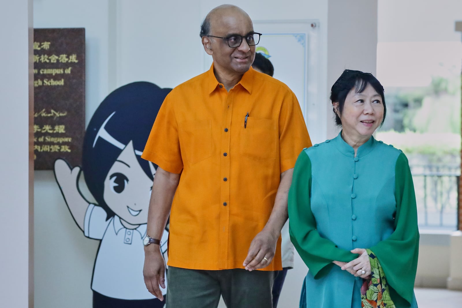 President of Singapore, Tharman Shanmugaratnam and his wife Jane Yumiko Ittogi leave the polling station after casting their votes during the general election in Singapore, Saturday, May 3, 2025. (AP Photo/Suhaimi Abdullah)
