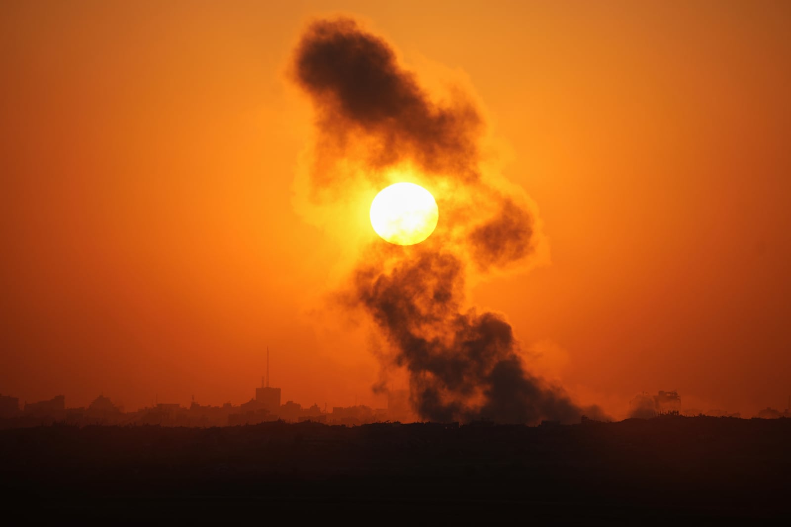 Smoke billows from an explosion in the northern Gaza Strip, as seen from southern Israel Wednesday, July 23, 2025. (AP Photo/Ohad Zwigenberg)