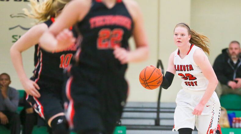 Notre Dame-bound Lakota West guard Abby Prohaska (32) brings the ball up the floor during a Division I district final against Tecumseh at Harrison on Feb. 27. GREG LYNCH/STAFF
