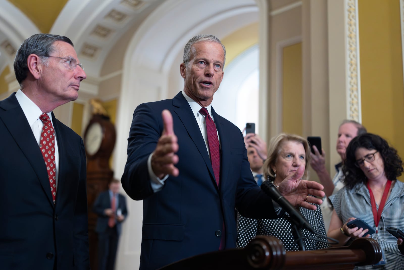 Senate Majority Leader John Thune, R-S.D., joined at left by Sen. John Barrasso, R-Wyo., the GOP whip, speaks to reporters following closed-door strategy meetings, at the Capitol in Washington, Tuesday, July 22, 2025. (AP Photo/J. Scott Applewhite)