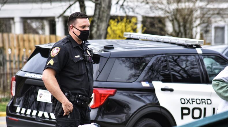 FILE: Miami University students celebrated their annual Green Beer Day in Oxford on Thursday, March 25, 2021. Because the city of Oxford has ordinances related to mass gatherings and wearing masks, police were monitoring activity throughout the day. NICK GRAHAM / STAFF