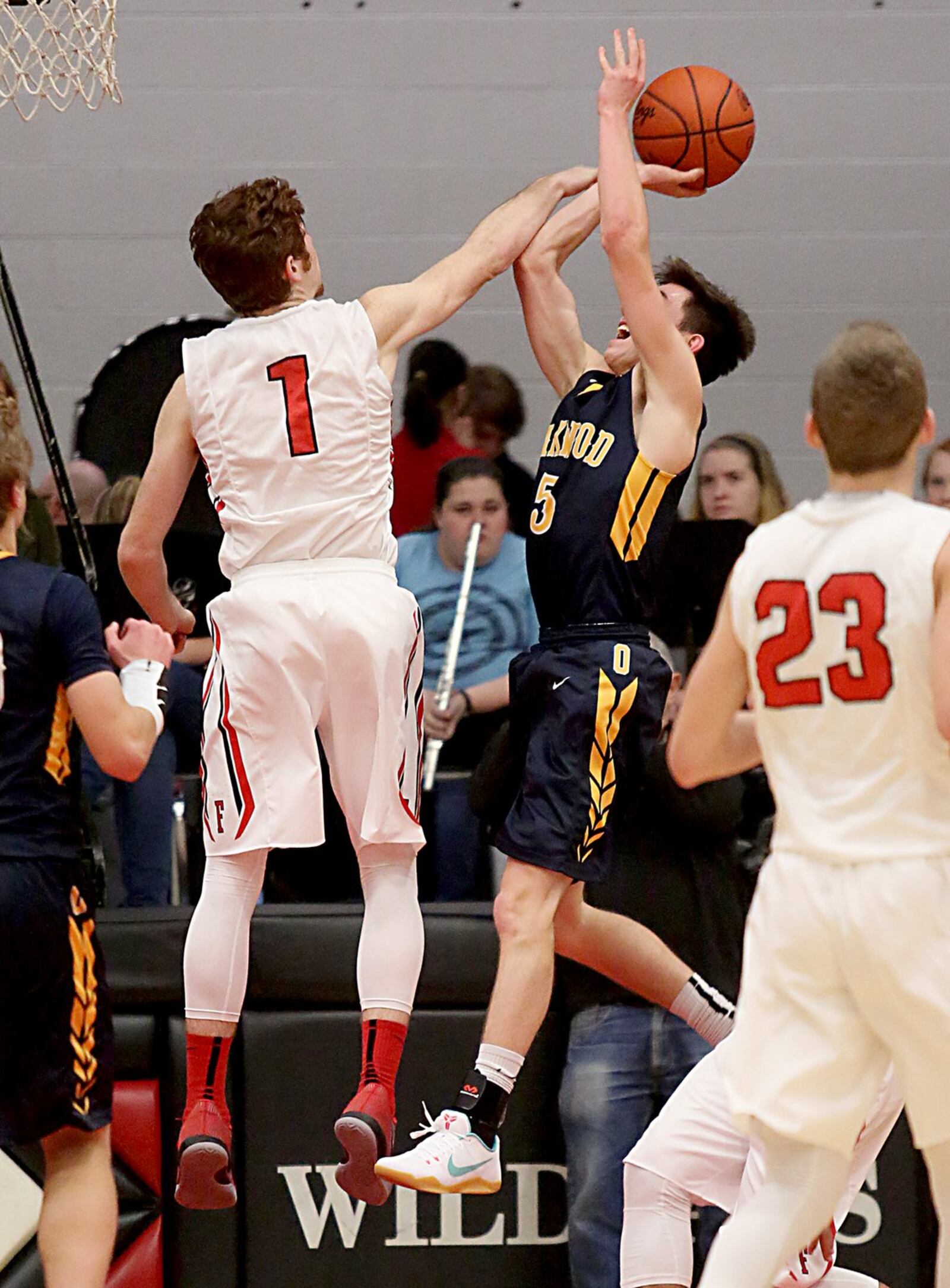 Franklin’s Noah Kremer goes after a shot by Oakwood’s Brendan Talarczyk during Tuesday night’s game at Darrell Hedric Gymnasium in Franklin. That’s the Wildcats’ Jared Kinzer (23) watching the play. CONTRIBUTED PHOTO BY E.L. HUBBARD