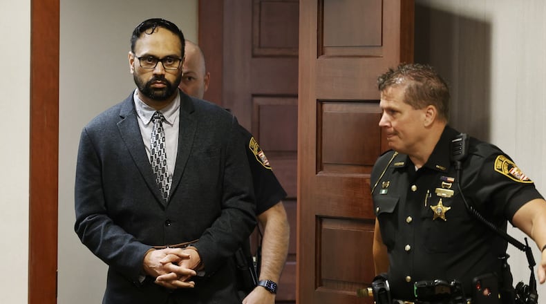 A 3-judge panel of Butler County judges Keith Spaeth, left, Gregory Howard, center, and Greg S. Stephens sentence Gurpreet Singh to death Tuesday, May 14, 2024 in Butler County Common Pleas Court in Hamilton. Gurpreet Singh was found guilty on all counts in for killing 4 members of his family in 2019 in West Chester Township. NICK GRAHAM/STAFF