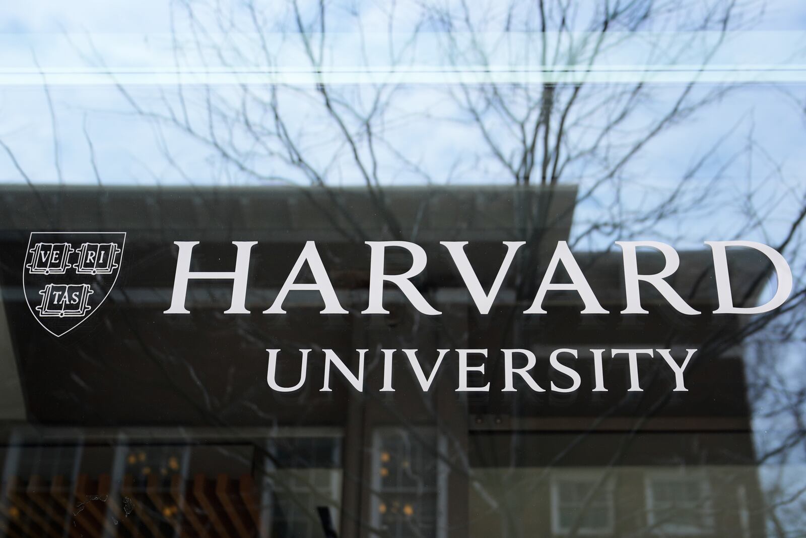 FILE - The Harvard University logo is displayed on a building at the school, Tuesday, April 15, 2025, in Cambridge, Mass. (AP Photo/Charles Krupa, File)