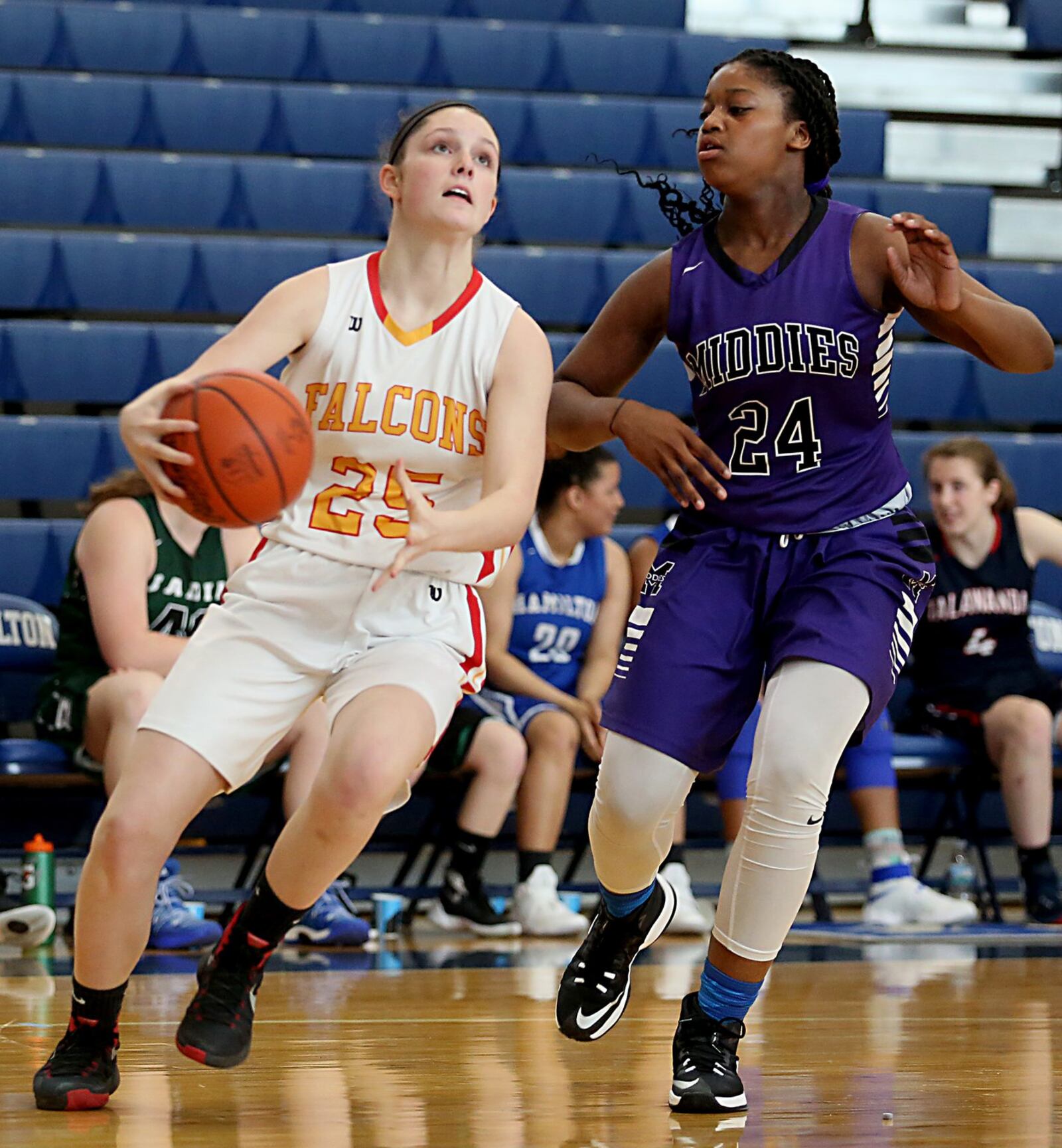 Fenwick’s Kaitlyn Anzel drives to the hoop while being defended by Middletown’s Olivia Wells-Daniels during the inaugural All-Butler County All-Star girls basketball game at the Hamilton Athletic Center on Saturday. CONTRIBUTED PHOTO BY E.L. HUBBARD
