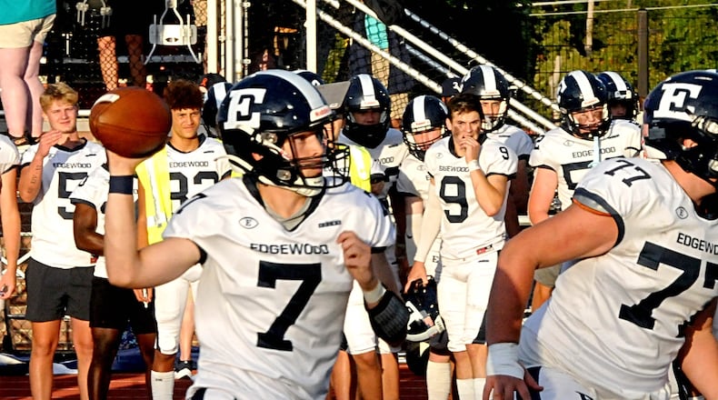 Edgewood quarterback Ryan French, 7, looks downfield as he prepares to pass during the first quarter of a non-conference game at Talawanda on Friday, Sept. 8. DAVID A. MOODIE/CONTRIBUTING PHOTOGRAPHER
