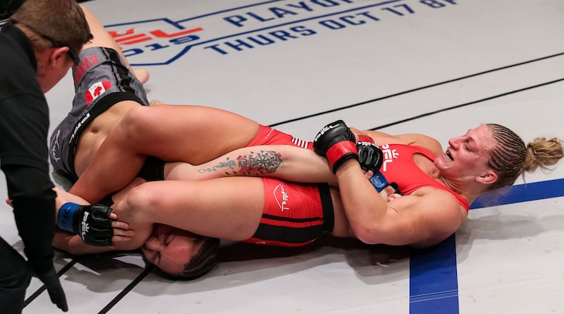 Kayla Harrison, from Middletown, uses her signature armbar move to defeat late-notice replacement Bobbi Jo Dalziel (5-2) in less than four minutes with a submission win Friday night in Las Vegas. PHOTO BY RYAN LOCO/PTL
