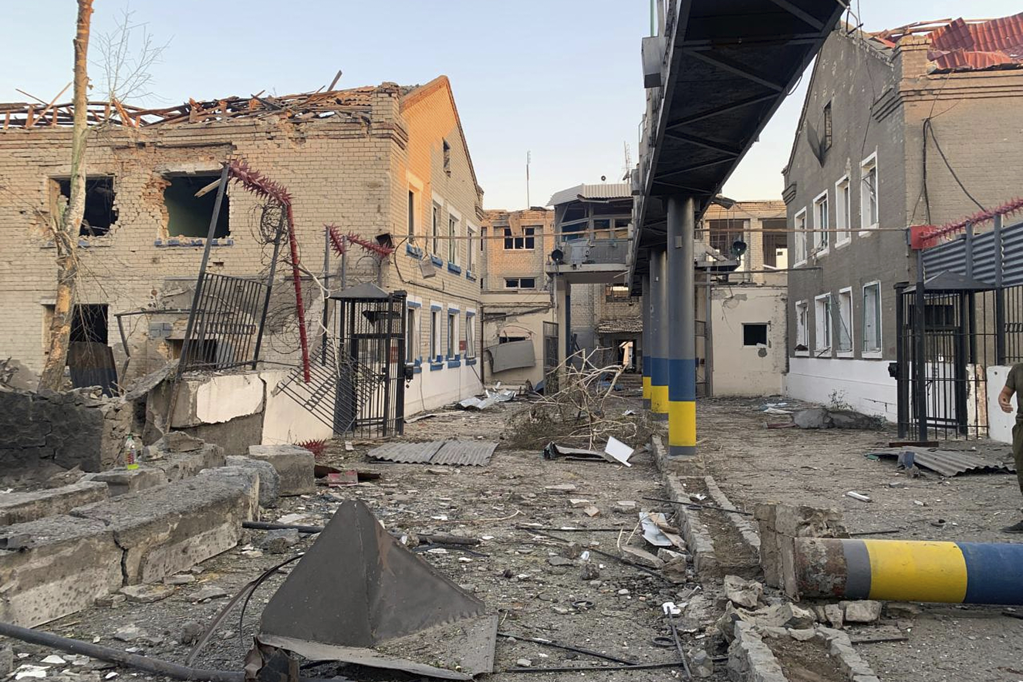 This photo provided by Ukraine's State Criminal Executive Service shows a damaged prison in the village of Bilenke, in Ukraine's Zaporizhzhia region, following a Russian bomb attack that killed at least 17 inmates, on Tuesday, July 29, 2025. (Ukraine's State Criminal Executive Service via AP)