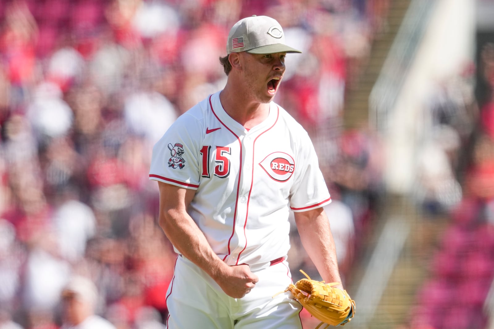 Cincinnati Reds pitcher Emilio Pagán reacts after striking out Cleveland Guardians' Will Brennan for the final out of a baseball game, Sunday, May 18, 2025, in Cincinnati. (AP Photo/Jeff Dean)