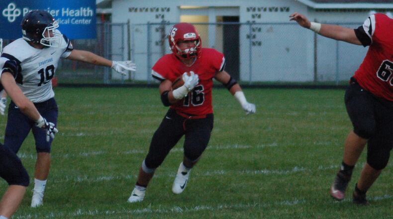 Madison running back Tyler Baumgartner runs through a huge hole in the first half of a 32-7 loss to Valley View on Sept. 8 at Madison. CONTRIBUTED PHOTO BY JOHN CUMMINGS