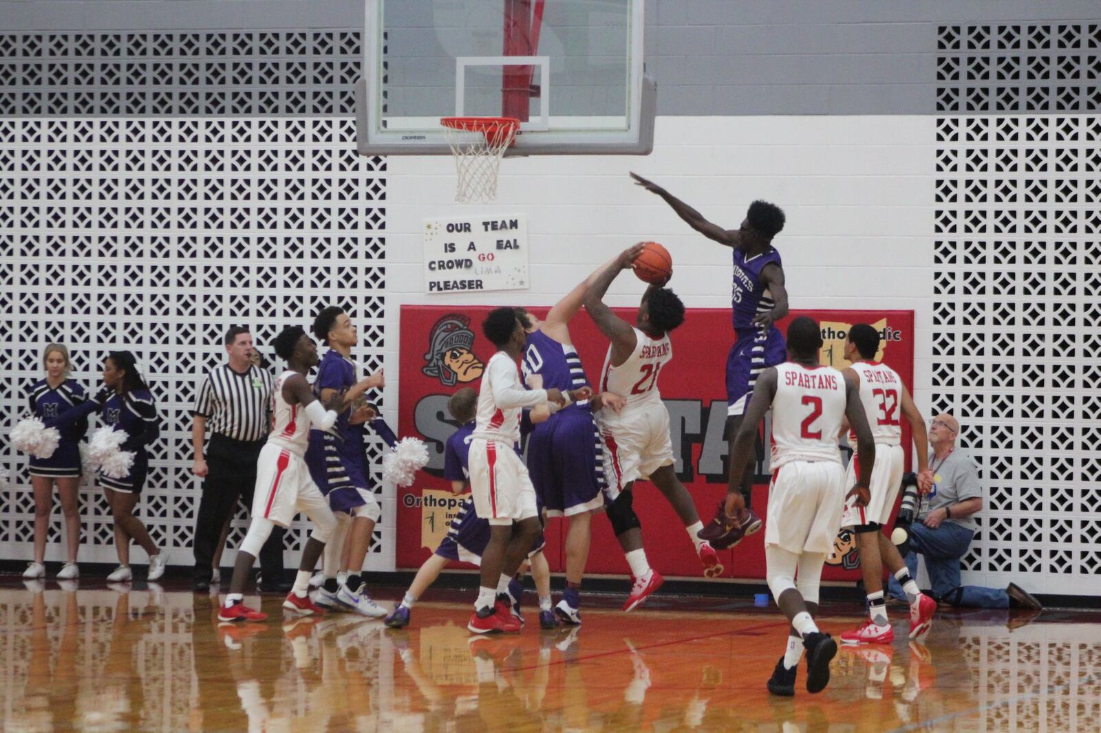 Middletown’s Chris Stallworth (40) and Jomar Bailey (35) go after a shot by Lima Senior’s Dre Williams during Friday night’s game in Lima. CONTRIBUTED PHOTO BY MARITZA MCKINNEY