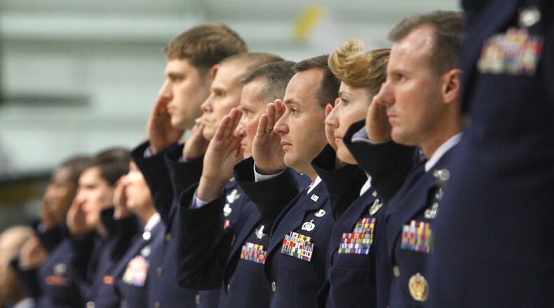 FILE: In 2008 U.S. Air Force personnel who work at the National Air and Space Intelligence Center (NASIC) make their first salute to incoming NASIC Commander Co. D. Scott George during a change of command ceremony at the National Museum of the United States Air Force on Tuesday, June 17, 2008. Col. George assumed command from Col. Karen A. Cleary. The commander in 2019 Col. Parker H. Wright. Staff photo by Ty Greenlees