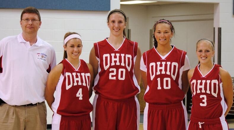 In a 2010 photo, Jim Dabbelt, left, is pictured with Allie Turner (Greenon), Cassie Sant (Fairmont), Courtney Boyd (Brookville) and Kacie Cassell (Vandalia Butler) after Ohio routed Kentucky 84-55 in the 19th annual Ohio-Kentucky All-Star game at Thomas More College.