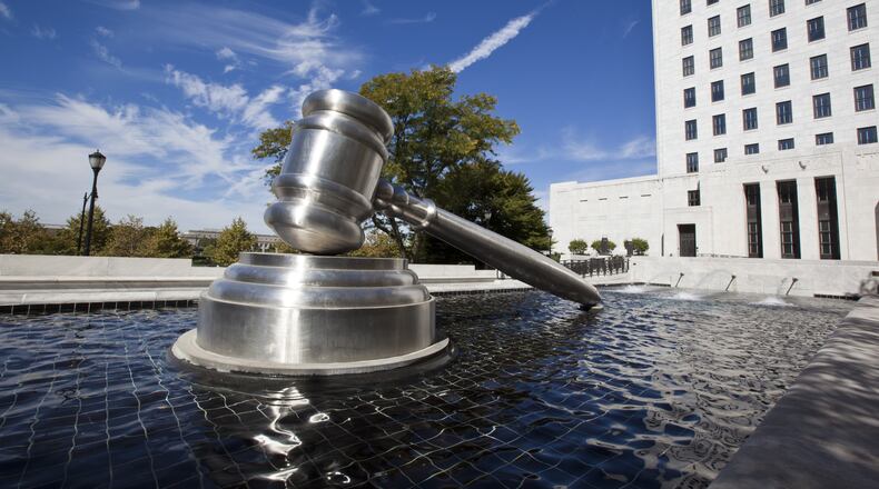 The Gavel Sculpture in downtown Columbus sits in the reflecting pool alongside the Ohio Supreme Court building.