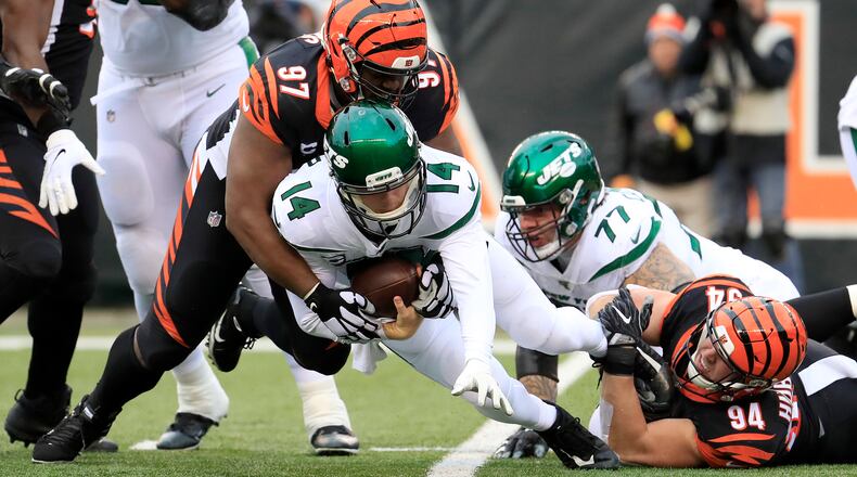 CINCINNATI, OHIO - DECEMBER 01: Sam Darnold #14 of the New York jets is sacked by Geno Atkins #97 and Sam Hubbard #94 of the Cincinnati Bengals at Paul Brown Stadium on December 01, 2019 in Cincinnati, Ohio. (Photo by Andy Lyons/Getty Images)
