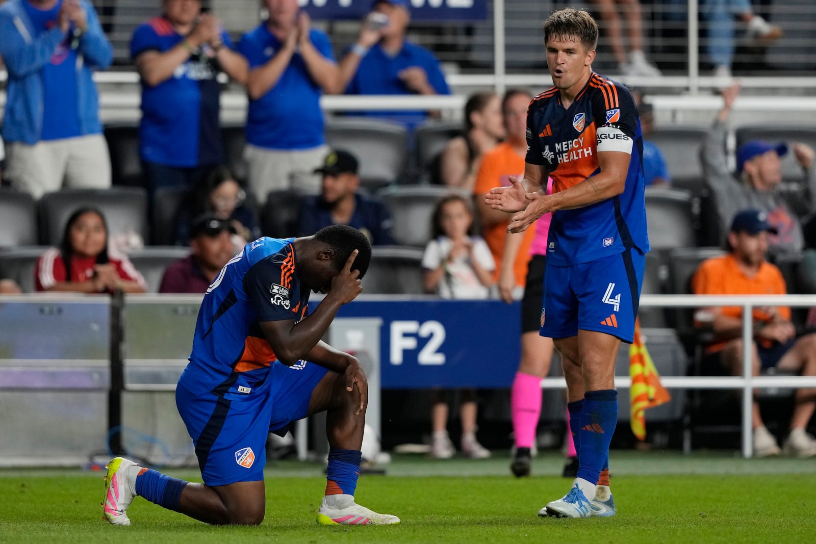 FC Cincinnati forward Andrés Dávila, left, reacts after scoring as defender Nick Hagglund is left during the second half of a Leagues Cup soccer match against Chivas Guadalajara, Thursday, Aug. 7, 2025, in Cincinnati. (AP Photo/Carolyn Kaster)