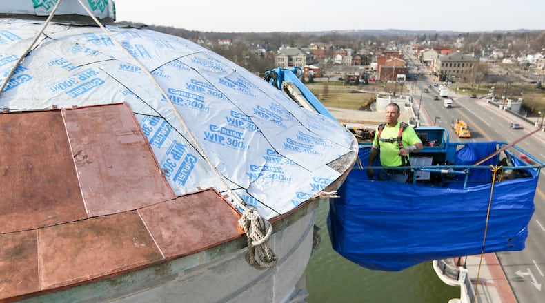 The old copper from the Soldiers Sailors and Pioneers monument in downtown Hamilton isn’t headed for the scrap yard. Parts of it will be used for a new sculpture. Other pieces will be used by local artists to creat Christmas ornaments for purchase. GREG LYNCH/STAFF