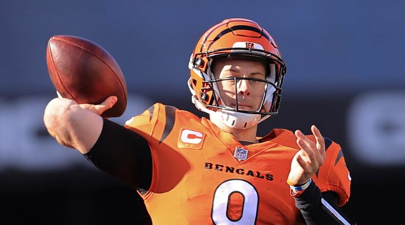 Cincinnati Bengals quarterback Joe Burrow (9) looks to pass against the Pittsburgh Steelers during the first half of an NFL football game, Sunday, Nov. 28, 2021, in Cincinnati. (AP Photo/Aaron Doster)