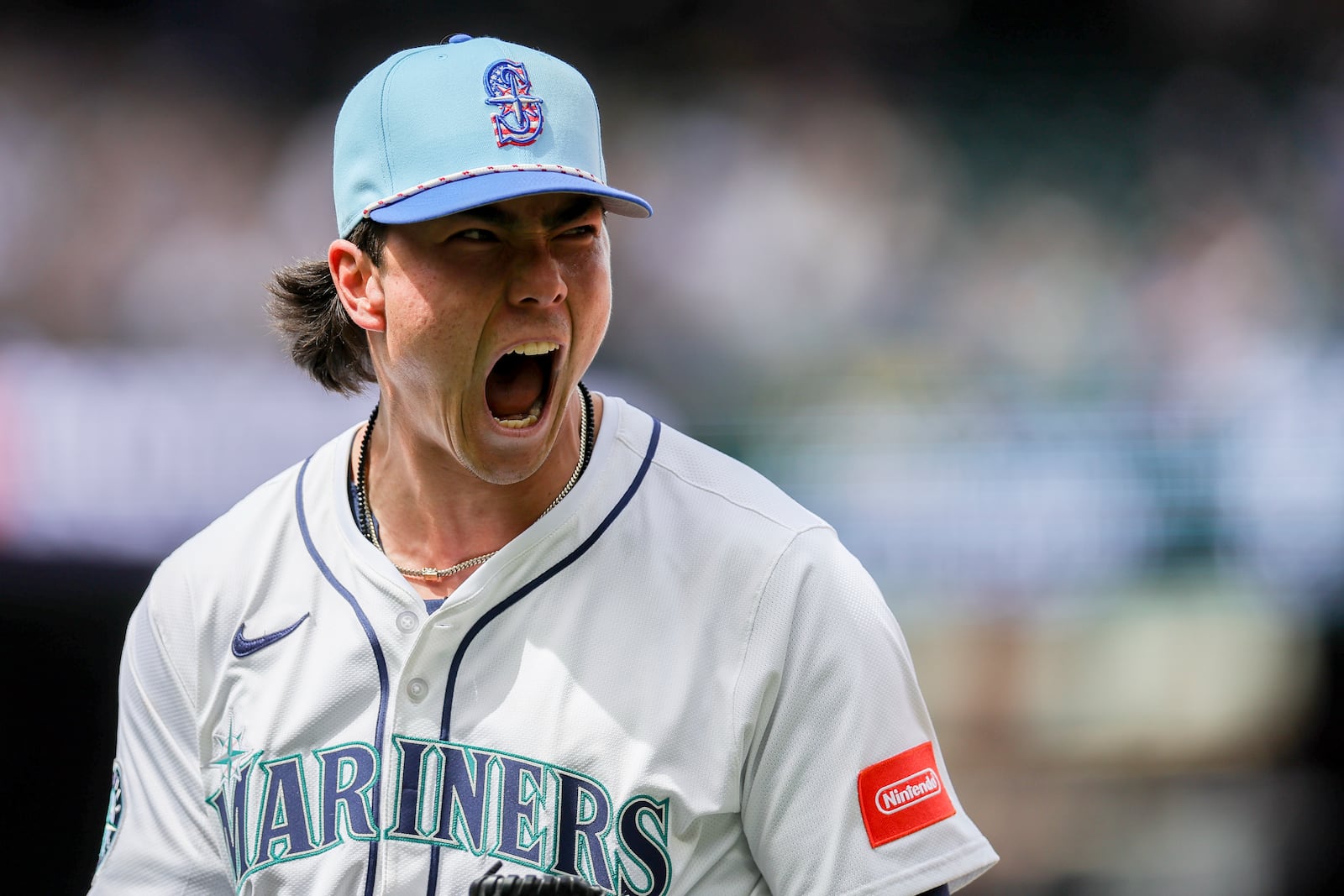 Seattle Mariners starting pitcher Bryan Woo reacts after Pittsburgh Pirates' Nick Gonzales was called out at first base during the sixth inning of a baseball game Friday, July 4, 2025, in Seattle. (AP Photo/Ryan Sun)