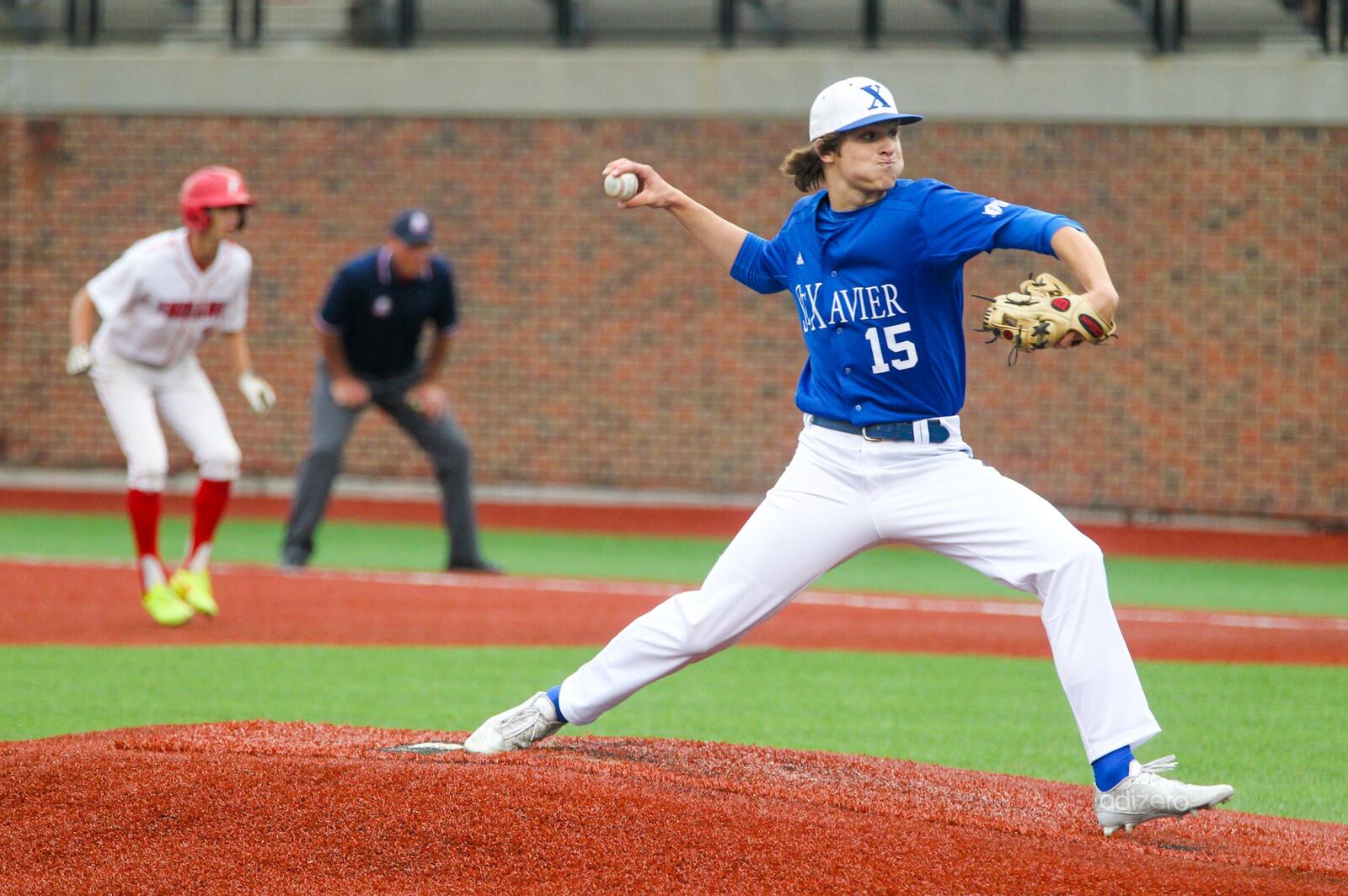 St. Xavier pitcher Nathan Kappers (15) deals to the plate Thursday during a Division I regional semifinal at the University of Cincinnati’s Marge Schott Stadium. GREG LYNCH/STAFF
