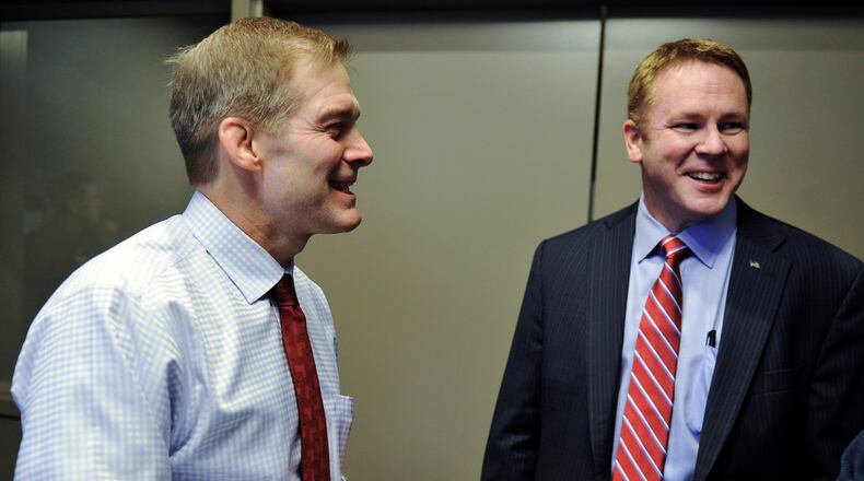 Congressman Warren Davidson, R-Troy, is supporting fellow Ohioan, Congressman Jim Jordan, R-Urbana, to be the next U.S. House speaker. Pictured is Jordan, left, on Jan. 21, 2016, at Homewood Suites in West Chester Twp. after he announced his endorsement of Davidson, right, in the race to replace former U.S. House Speaker John Boehner. NICK GRAHAM/FILE