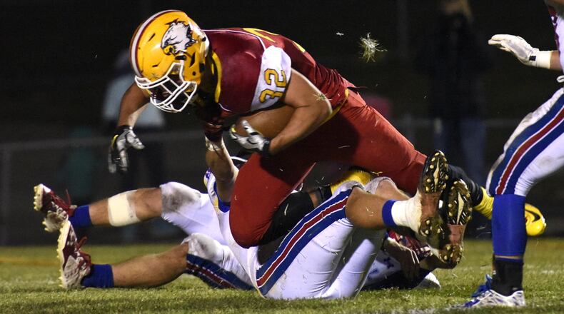 Fenwick’s Andy Riazzi carries the ball during a game against visiting Carroll on Oct. 30, 2015, at Krusling Field in Middletown. NICK GRAHAM/STAFF