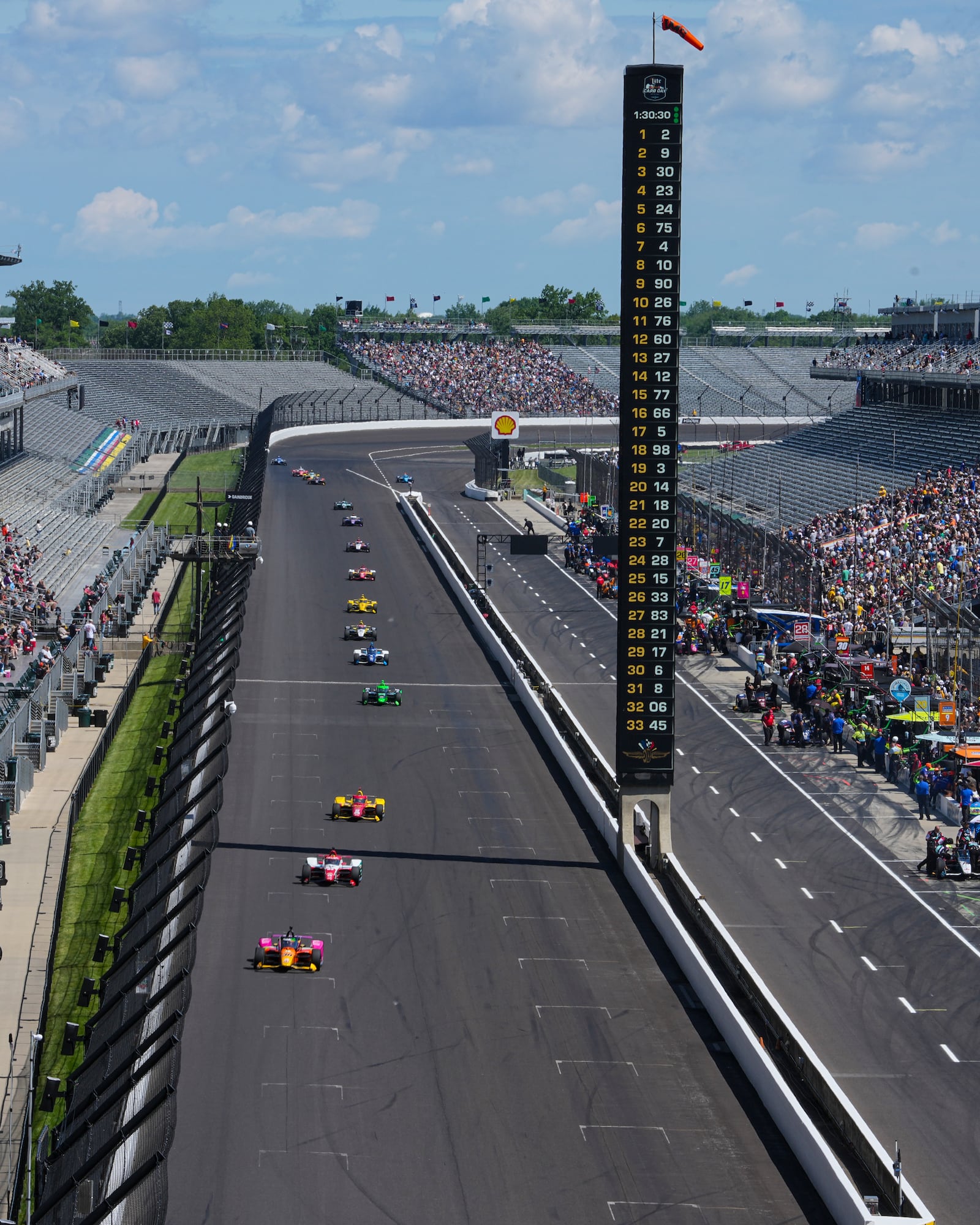 Devlin DeFrancesco, of Canada, leads a pack of cars during practice for the Indianapolis 500 auto race at Indianapolis Motor Speedway in Indianapolis, Friday, May 23, 2025. (AP Photo/Michael Conroy)