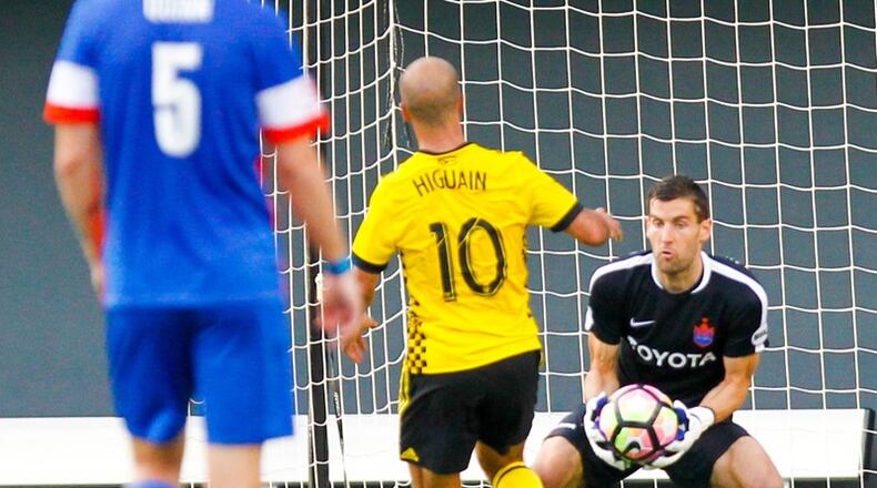 FC Cincinnati goalie Mitch Hildebrandt (1) stops a shot during their Open Cup match against the Columbus Crew, held at Nippert Stadium on the campus of the University of Cincinnati in June. GREG LYNCH / STAFF