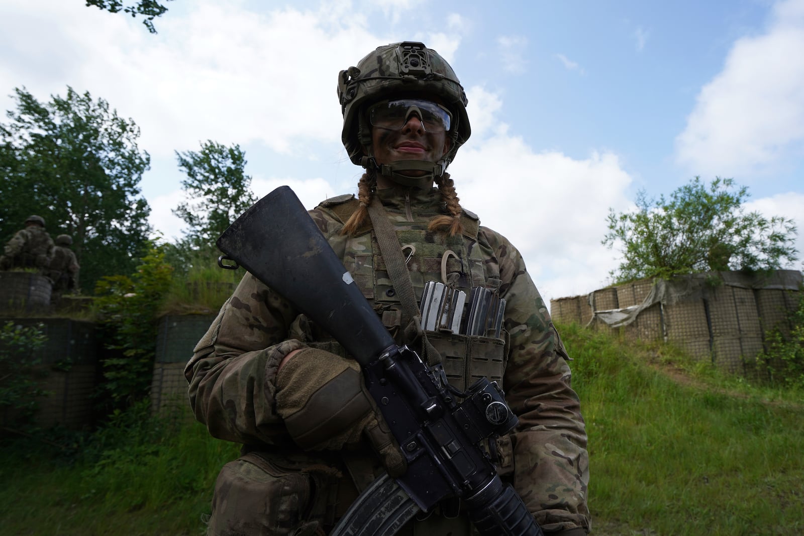 20-year-old conscript Katrine poses for a photo during final exercises at a training area close to Royal Danish Army’s barracks in Hovelte, 25 kilometres north of Copenhagen, Denmark, Wednesday, June 11, 2025. (AP Photo/James Brooks)