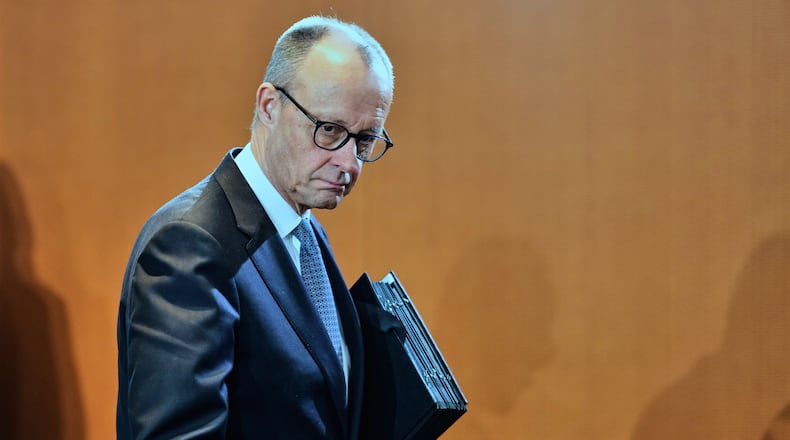 German Chancellor Friedrich Merz arrives for the cabinet meeting at the chancellery in Berlin, Germany, Wednesday, Jan. 28, 2026. (AP Photo/Markus Schreiber)