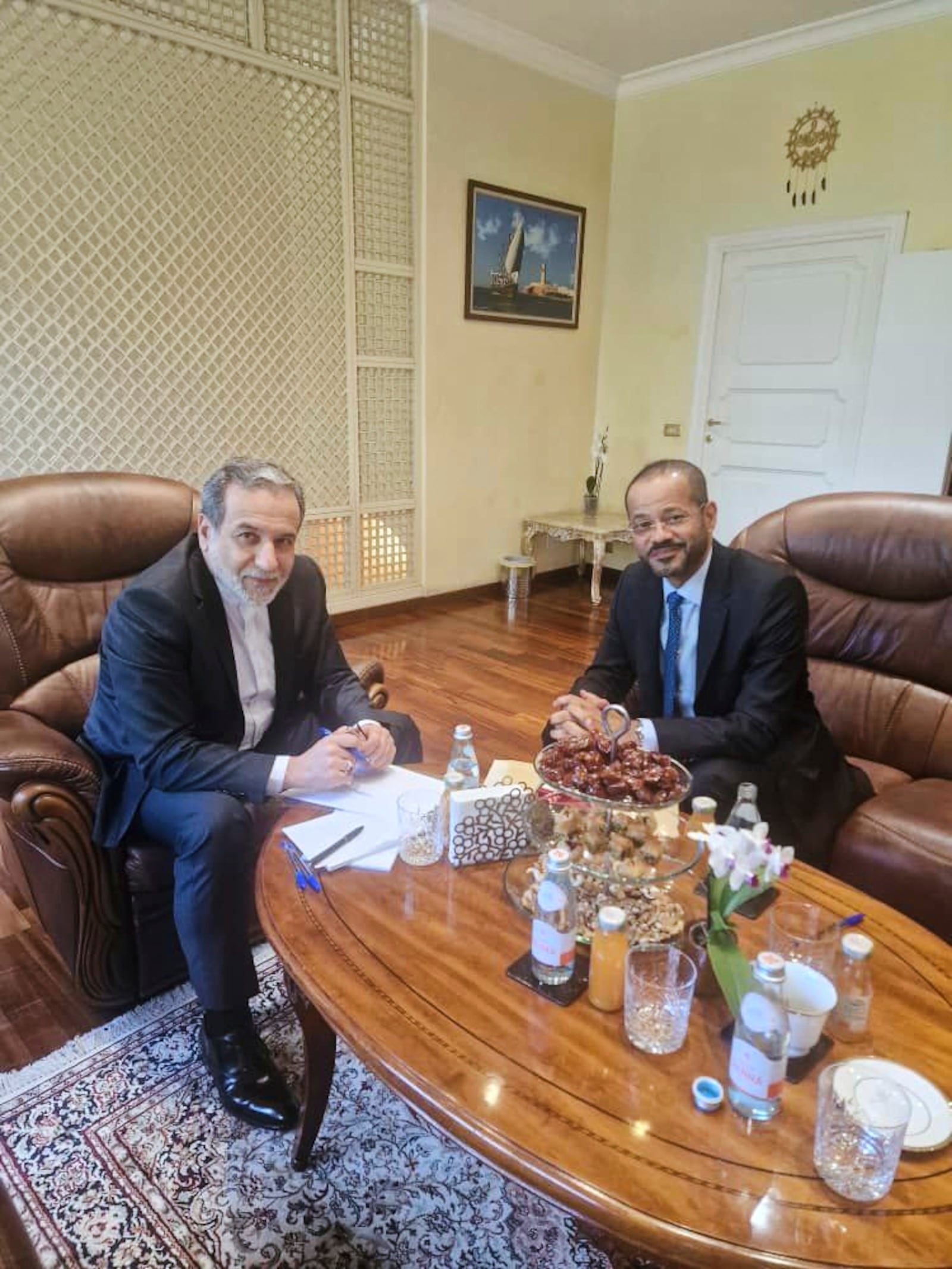 In this photo released by the Iranian Foreign Ministry, Iranian Foreign Minister Abbas Araghchi, left, meets with his Omani counterpart Sayyid Badr Albusaidi at the Omani Embassy in Rome during the fifth round of Iran-U.S. negotiations, Friday, May 23, 2025. (Iranian Foreign Ministry via AP)