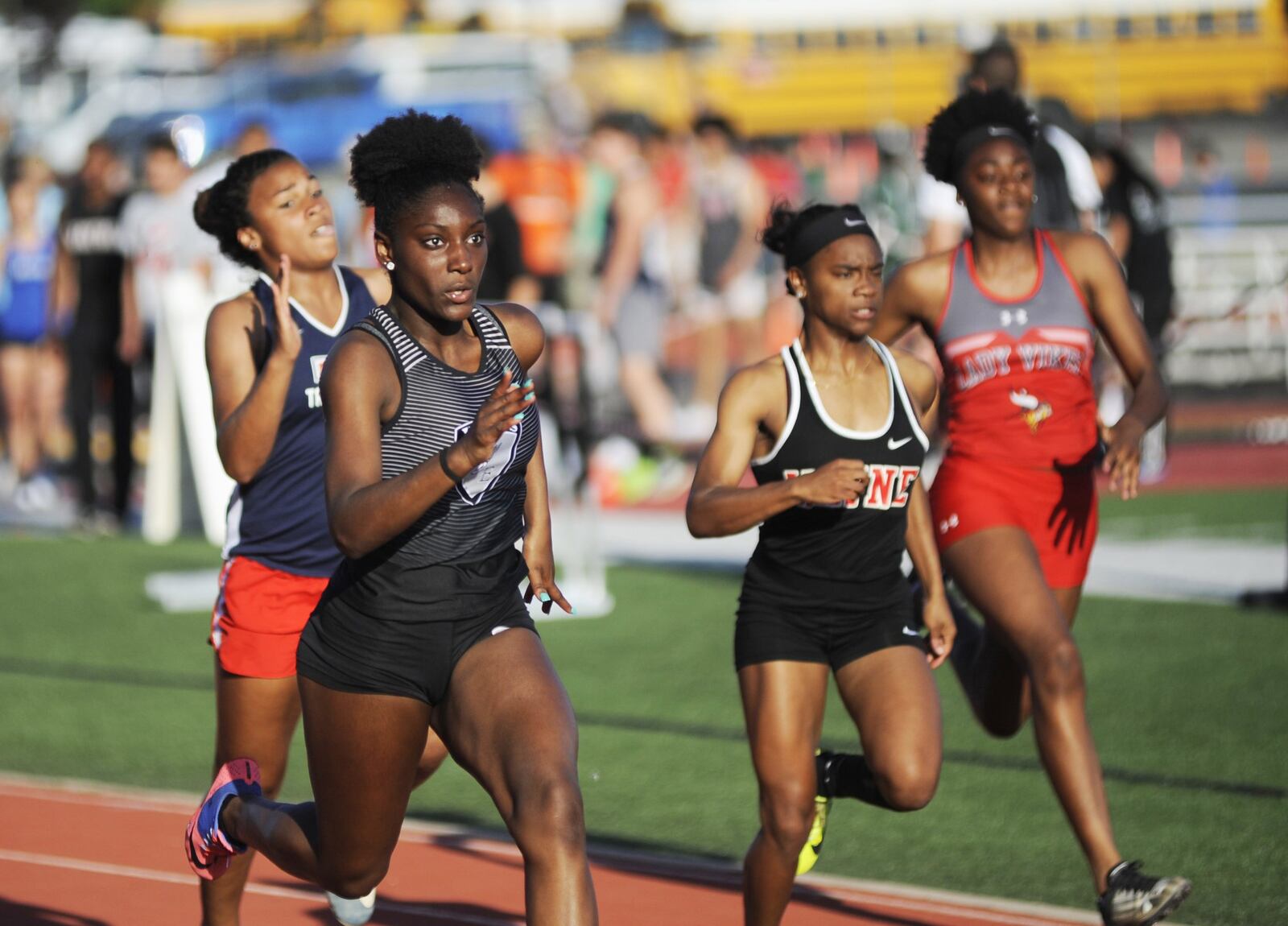 Lakota East sophomore Serena Clark (near left) bested a 100-meter record that had stood since 1990 with an 11.79 in qualifying during the first day of the Division I regional track and field meet at Wayne High School in Huber Heights on May 23, 2018. MARC PENDLETON/STAFF