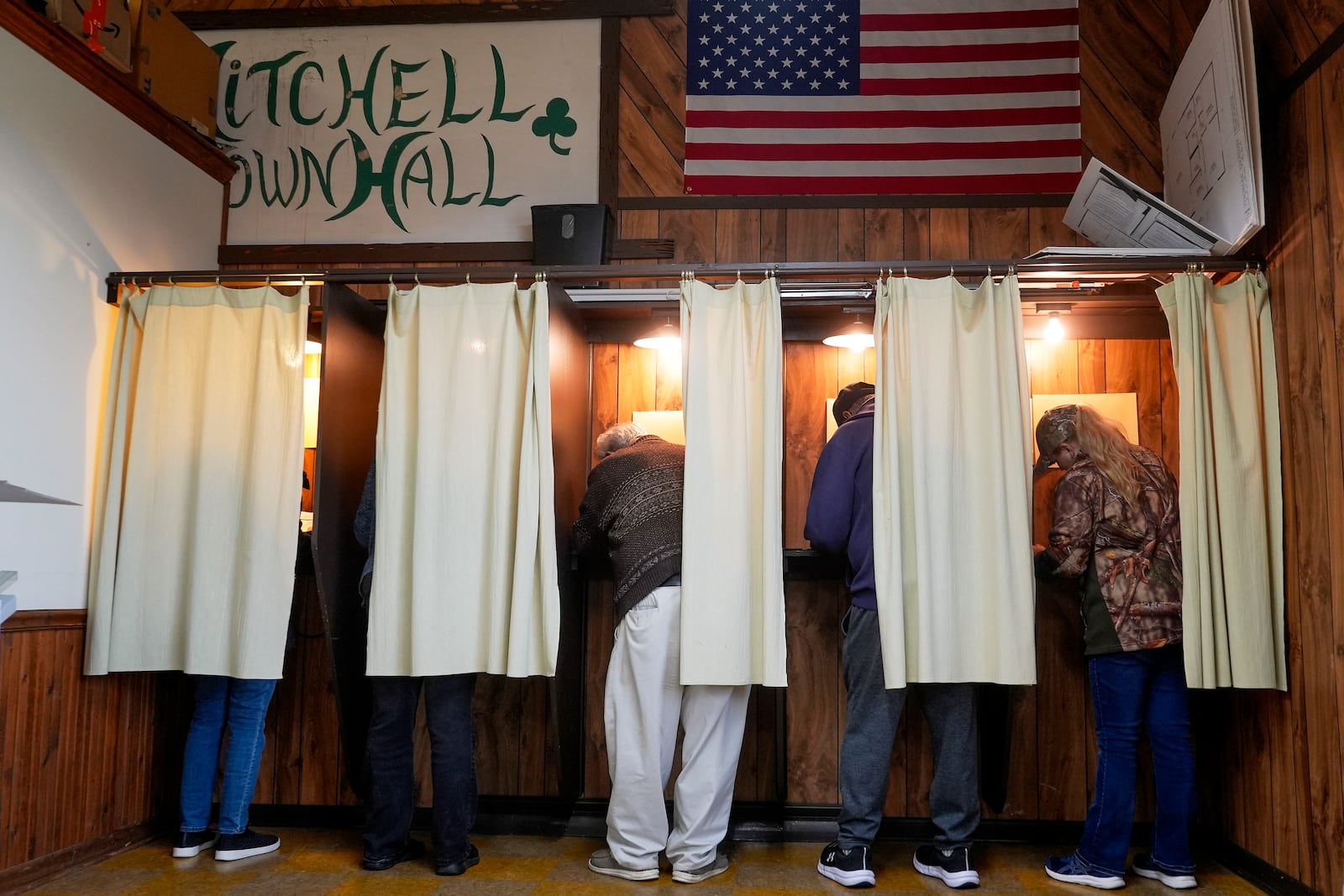 FILE - Voters mark their ballots at a polling place, Nov. 5, 2024, in Mitchell, Wis. (AP Photo/Morry Gash, File)
