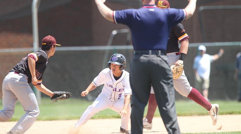 Ross second baseman Ethan Hall catches Cincinnati Hills Christian Academy’s Griffin Hughes in a rundown but the umpire had called time and he returned to first in the first inning on Thursday, May 24, 2018, at Mason High School. David Jablonski/Staff