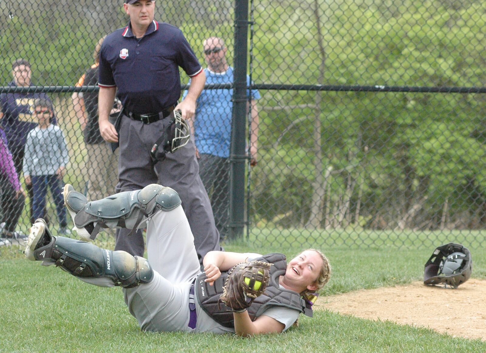 Eaton catcher Becca Mowen grabs a foul popup Wednesday during a Southwestern Buckeye League Southwestern Division softball game at Monroe. Eaton won 5-1. RICK CASSANO/STAFF