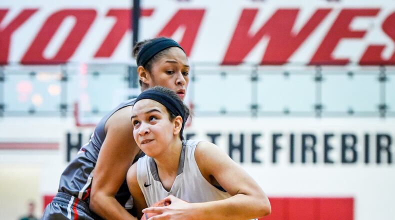 Lakota East’s Jordan Stanley drives to the basket while being defended by Princeton’s Aja Knott during their Division I sectional game Feb. 22, 2017, at Lakota West. NICK GRAHAM/STAFF