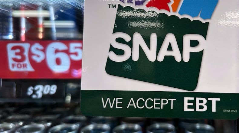 FILE - SNAP EBT information sign is displayed at a gas station in Riverwoods, Ill., Saturday, Nov. 1, 2025. (AP Photo/Nam Y. Huh, file)