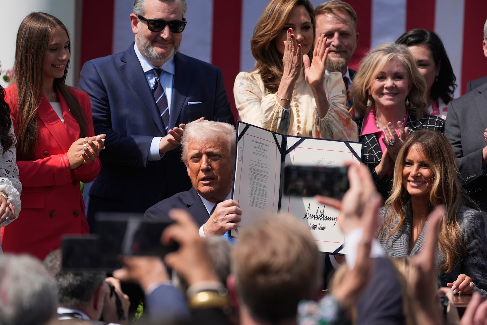President Donald Trump, with first lady Melania Trump and others, after signing the "Take It Down Act" during a ceremony in the Rose Garden at the White House, Monday, May 19, 2025. (AP Photo/Manuel Balce Ceneta)