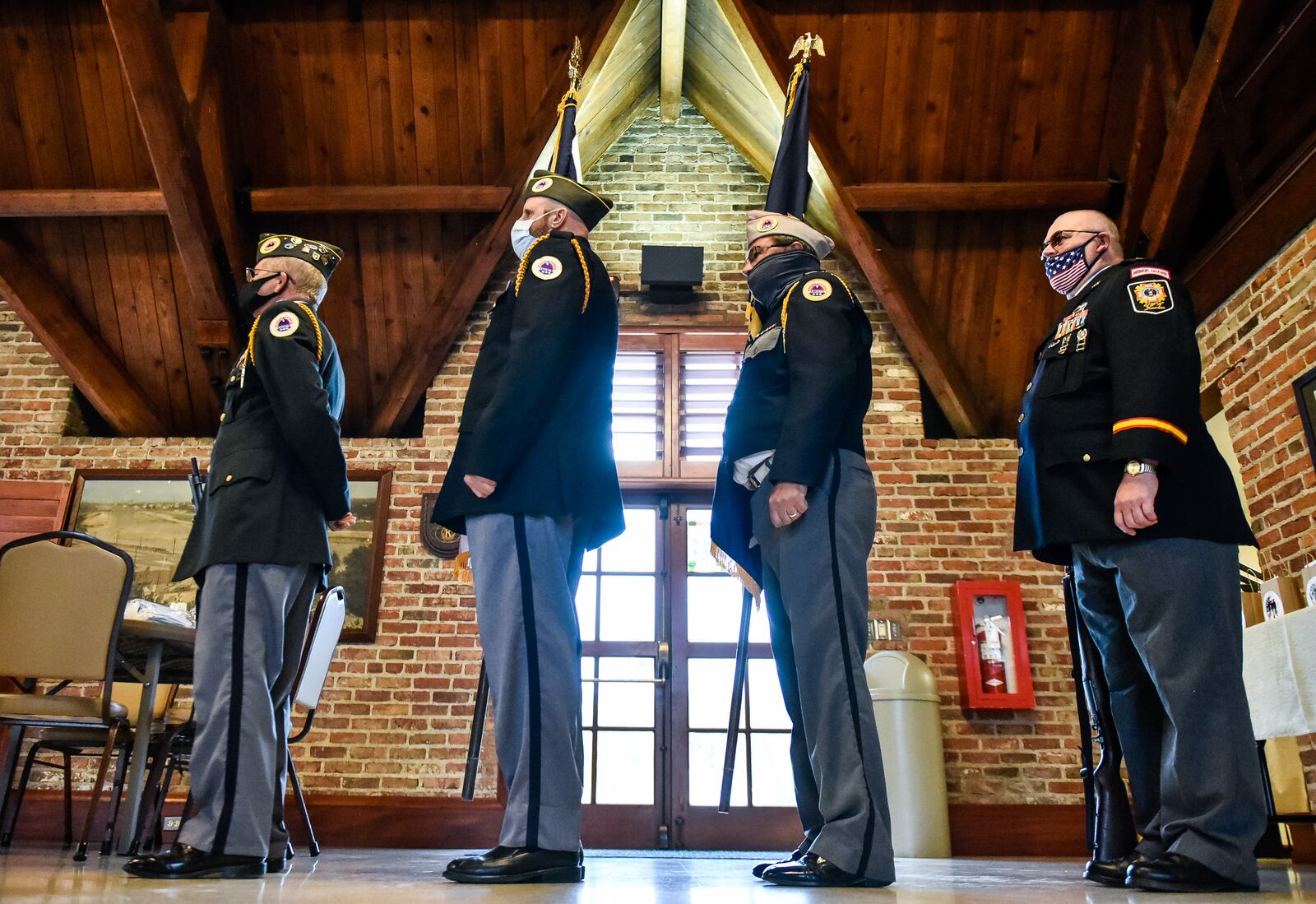 AmVets Post 1983 Joint Honoro Guard presented colors for the Butler County Veterans Service Commission annual Veteran of the Year award ceremony on Veterans Day Wednesday, Nov. 11, 2020 at Michael J. Cooligan Lodge at Veterans Park in Hamilton. Air Force veteran James Carl Lewis was the recipient this year. NICK GRAHAM / STAFF